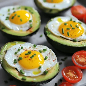 - 2 ripe avocados - 4 large eggs - Salt and pepper to taste - 1 tablespoon olive oil - 2 tablespoons fresh chives, chopped - 1/2 teaspoon smoked paprika - Cherry tomatoes, halved (for garnish) When you gather your ingredients, pick ripe avocados. They should yield slightly when you press them. Fresh eggs make a big difference too. Use large eggs for the best fit in the avocado halves. Don't forget the salt and pepper. These simple seasonings will enhance all the flavors. - Calories: 420 - Protein: 18g - Fats: 36g - Carbs: 18g This meal packs a nutritional punch. Avocados provide healthy fats, while eggs add protein. Together, they form a well-rounded breakfast that keeps you full. Nutritional benefits of avocados Avocados are rich in monounsaturated fats. These healthy fats support heart health. They also contain fiber, which aids digestion. Plus, avocados are loaded with vitamins like E and K. Health advantages of eggs Eggs are a great source of protein. They contain all nine essential amino acids. Eggs also provide choline, which is good for brain health. Eating eggs can help you feel full longer. 1. Preheating the oven: Start by preheating your oven to 425°F (220°C). This is the right temperature for baking the eggs in your avocado boats. Preheating ensures an even cook. 2. Preparing the avocados: Take two ripe avocados. Cut them in half and remove the pit. If the hole isn’t deep enough, scoop out a little flesh from the center. This gives the egg enough space. Place the avocado halves in a small baking dish. You may need to use crumpled aluminum foil to keep them stable. 1. Baking time and temperature settings: Place the prepared avocados in the oven. Bake them for about 15 to 20 minutes. The time will depend on how you like your eggs. Less time gives you runny yolks. More time will make them firm. 2. Tips for achieving desired egg doneness: Keep an eye on your eggs. If you want them runny, check at the 12-minute mark. For firmer yolks, let them bake longer. Remember, eggs will continue to cook a bit after you take them out. 1. How to garnish the dish: Once baked, it’s time for the finishing touches. Remove the avocado boats from the oven. Sprinkle chopped chives over them. You can add salt and pepper for extra flavor. 2. Serving suggestions: Garnish with halved cherry tomatoes. They add a fresh pop of color and taste. Serve the avocado egg boats warm, maybe with toast or a simple salad on the side. Enjoy your meal! To make your avocado egg breakfast boats perfect, timing is key. You can adjust the baking time based on how you like your yolks. If you want runny yolks, bake for about 15 minutes. For firmer yolks, let them bake for 20 minutes. Choosing ripe avocados is also very important. Ripe avocados are soft to the touch. They will hold the egg well and taste great. If your avocados are not ripe, they will not work as well. You will need a few simple tools to create these tasty boats. A baking dish works best to hold the avocados steady. A spoon helps to remove any extra egg white. Sometimes, avocado halves can tip over. You can stabilize them with crumpled aluminum foil. Just place the foil in the baking dish to support the avocado halves. This step keeps everything in place while baking. Get creative with your breakfast boats! You can add cheese or fresh herbs for more flavor. Cheese like feta or cheddar melts wonderfully over the egg. Fresh herbs like basil or parsley add a nice touch as well. Seasoning is also fun to change up. If you want a kick, try adding chili flakes or a dash of hot sauce. For a different taste, use garlic powder or onion powder. The options are endless! {{image_2}} You can change the ingredients in your avocado egg breakfast boats. Try using different veggies or proteins. For a fresh crunch, add bell peppers or spinach. These will boost flavor and nutrition. If you want a vegan version, swap the egg for tofu. Use silken tofu for a creamy texture. You can also add nutritional yeast for a cheesy flavor. This keeps the dish tasty without eggs. Make your breakfast boats special with different themes. For a Mediterranean style, add feta cheese, olives, and sun-dried tomatoes. This gives a bright, salty taste that pairs well with avocado. For a spicy Southwest twist, include diced jalapeños, black beans, and corn. Top with cilantro and lime juice. It adds heat and zest, making your breakfast exciting. Pair your avocado egg boats with side dishes or drinks. A light salad or some toast works well. You can also serve them with fresh fruit. This adds color and balance to your meal. Presentation is key for brunch. Place the boats on a colorful plate. Add fresh herbs or cherry tomatoes around them. This makes your dish look as good as it tastes. Store leftover avocado egg boats in an airtight container. Keep them in the fridge for up to two days. If possible, separate the egg from the avocado to prevent browning. You can also cover the avocado flesh with lemon juice. This will help slow down the browning process. To reheat, use the oven or a microwave. If using the oven, preheat it to 350°F (175°C). Place the avocado boats in a baking dish and cover with foil. Heat for about 10 minutes, or until warm. If using a microwave, place the boat on a plate. Heat in 30-second intervals until warm. Be careful not to overcook the eggs. You can prepare ingredients in advance. Scoop out the avocado and store it in the fridge. Keep the eggs in their shells until ready to use. You can also chop chives and store them in a small container. For quick breakfasts, assemble the boats the night before. Just cover and place them in the fridge. In the morning, bake them for a quick meal. To keep your avocado fresh, use lemon juice. The acid slows browning. After cutting, splash some juice over the flesh. Store the avocado in an airtight container. Wrap it tightly in plastic wrap, too. If you are serving them, wait until just before serving to cut them. This keeps them bright and green. Yes, you can prepare for busy mornings! You can scoop out the avocado and store it in a container with lemon juice. You can crack the eggs into a bowl and cover it. When you are ready to bake, just fill the avocado halves and bake them. This saves time and still gives you a warm breakfast. If you lack smoked paprika, don’t worry! You can use regular paprika as a substitute. If you want more flavor, add a pinch of cayenne pepper. You can also try garlic powder or chili powder for a tasty twist. Seasoning is flexible, so feel free to experiment! In this post, we explored a simple and tasty recipe for avocado egg boats. You learned about the key ingredients and their health benefits, like how avocados offer healthy fats and eggs provide protein. I shared step-by-step instructions for preparation and cooking, plus tips to perfect your meal. You also discovered fun variations and storage tips for leftovers. I hope you try this recipe and enjoy every bite. Cooking can be easy and fun, especially when you have tasty ideas to follow. Happy cooking!