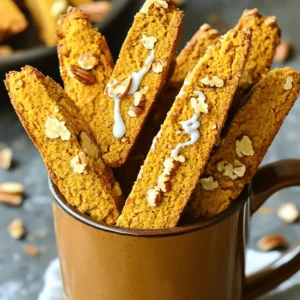 - 2 cups all-purpose flour - 1 teaspoon baking powder - ½ teaspoon baking soda - 1 teaspoon pumpkin pie spice - ½ teaspoon salt To start, gather your dry ingredients. The all-purpose flour gives the biscotti structure. Baking powder and baking soda help it rise. Pumpkin pie spice brings warmth and flavor. Salt balances the sweetness, enhancing all the flavors. - ¼ cup unsalted butter, softened - ¾ cup granulated sugar - 2 large eggs - 1 teaspoon vanilla extract - 1 cup pumpkin puree (canned or fresh) Next, you’ll need the wet ingredients. Unsalted butter adds richness. Granulated sugar sweetens and helps create a light texture. Eggs bind everything together while adding moisture. Vanilla extract adds a lovely aroma. Pumpkin puree gives that classic fall flavor and keeps the biscotti soft. - 1 cup white chocolate chips - ¼ cup chopped pecans (optional) Finally, don’t forget the mix-ins! White chocolate chips add sweetness and creaminess. Chopped pecans give a nice crunch. You can skip the pecans if you want a smoother texture. These ingredients make the biscotti truly delightful. First, set your oven to 350°F (175°C). This temperature helps the biscotti bake evenly. Next, take a baking sheet and line it with parchment paper. This step keeps the biscotti from sticking and makes cleanup easy. In a bowl, whisk these dry ingredients together: - 2 cups all-purpose flour - 1 teaspoon baking powder - ½ teaspoon baking soda - 1 teaspoon pumpkin pie spice - ½ teaspoon salt Set this bowl aside. In a large mixing bowl, cream together: - ¼ cup unsalted butter, softened - ¾ cup granulated sugar Mix until it's light and fluffy. Next, add in: - 2 large eggs, one at a time - 1 teaspoon vanilla extract - 1 cup pumpkin puree Blend until well combined. Now, take your dry mix and fold it into the wet ingredients. Be careful not to overmix; just combine until you see no dry flour. If you want to add some fun, fold in: - 1 cup white chocolate chips - ¼ cup chopped pecans (optional) Transfer the dough onto a lightly floured surface. Shape it into a log about 12 inches long and 2-3 inches wide. Place this log onto your lined baking sheet. Now, it’s time for the first bake. Bake the log for 25-30 minutes, or until it feels firm to the touch. After that, cool it for about 10 minutes on the baking sheet. Once it has cooled, carefully slice the log into 1-inch wide pieces using a serrated knife. Arrange these slices cut side down on the baking sheet. Return the biscotti to the oven for a second bake. Bake for an additional 10-12 minutes until they are crisp and golden. Flip them halfway for even crispness. Finally, let the biscotti cool completely on a wire rack. Enjoy your tasty creation! To get the right texture for your biscotti, avoid overmixing. When you mix the dry and wet ingredients, do this gently. Overmixing can lead to tough biscotti. Instead, mix until you see no dry flour. You want a dough that feels firm but not too dry. It should hold its shape when you form it into a log. If it sticks to your hands, add a little flour. If it feels crumbly, mix in a tiny bit of water. To make your biscotti even more pumpkin-spiced, add a little more pumpkin pie spice. A half teaspoon more can boost the flavor without being too strong. You can also add a splash of maple syrup or a touch of brown sugar for extra richness. These ingredients deepen the taste and make each bite delightful. For serving, place your biscotti in a tall mug or a pretty box. This makes a great gift or a fun treat for yourself. Drizzling melted white chocolate on top adds a sweet touch. It makes the biscotti look fancy too. Use a spoon or a piping bag for a nice design. Enjoy them with coffee or tea for a cozy experience! {{image_2}} You can boost the taste of your pumpkin spice biscotti in fun ways. Adding nuts or dried fruits can give your biscotti a nice crunch. I love using chopped pecans for a rich, buttery flavor. You can also add dried cranberries or raisins for a sweet touch. Different types of chocolate can change the flavor as well. While white chocolate chips shine, dark chocolate can add a bold taste. Mix and match to find your favorite combination! If you need a gluten-free version, it’s easy to adapt! Use almond flour or a gluten-free flour blend. This keeps the texture light and gives a nice nutty flavor. Just follow the same steps in the recipe, and you won’t miss the gluten at all! For a vegan twist, you can replace the eggs. Use flax eggs or applesauce to bind the dough. This keeps the biscotti moist and delicious. Also, switch to plant-based butter and chocolate. There are many great options available that taste just as good. This way, you can enjoy pumpkin spice biscotti while sticking to your diet! To keep your pumpkin spice biscotti fresh, store them in an airtight container. This helps maintain their crispness. You can keep them at room temperature for up to a week. If you live in a humid area, use parchment paper between layers. This prevents them from getting soggy. For longer storage, freezing is the best option. Place the cooled biscotti in a freezer-safe bag. Remove as much air as possible before sealing. You can freeze them for up to three months. When you're ready to enjoy, thaw them at room temperature. For extra crispness, pop them back in the oven for a few minutes. When stored properly, these biscotti can last about a week at room temperature. In the freezer, they maintain quality for up to three months. After that, they may lose flavor and texture, but they are still safe to eat. Always check for any signs of spoilage before enjoying them. You can tell when biscotti is done by checking its firmness. During the first bake, the log should be firm to the touch, not soft. After slicing, for the second bake, look for a golden color and a crisp texture. A good rule is to bake until they are lightly brown and sound hollow when tapped. Yes, you can make these biscotti ahead of time. Bake them, then let them cool completely. Store them in an airtight container at room temperature for up to two weeks. If you want to keep them longer, you can freeze them for up to three months. Just thaw them at room temperature when you’re ready to enjoy. Pairing these biscotti can enhance your experience. For drinks, I recommend a warm latte or spiced chai. Both drinks match the pumpkin spice flavor well. You can also enjoy them with hot cocoa for a cozy treat. For food, consider a creamy cheese or a light fruit spread. These combinations create a delightful balance with the sweet biscotti. This post covers making delicious pumpkin spice biscotti. You learned about the needed ingredients, the mixing process, and baking steps. I also shared tips for perfect texture and flavor. There are ideas for variations to suit different diets, plus storage tips to keep your biscotti fresh. Enjoy making this treat as your new fall favorite. Whether you share them or savor them yourself, these biscotti will delight! Happy baking!