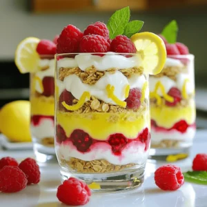 - 2 cups Greek yogurt - 2 tablespoons honey (or to taste) - Zest of 1 lemon - 2 tablespoons lemon juice - 1 cup fresh raspberries (plus extra for garnish) - 1 cup granola (choose your favorite) - Mint leaves for garnish (optional) The main ingredients create a fresh and tasty treat. Greek yogurt gives a creamy base. Honey adds sweetness and balances the tartness. Lemon zest and juice bring bright flavor. Fresh raspberries offer a juicy burst in each bite. Granola adds a crunchy texture. Mint leaves can add a lovely touch on top. - Additional honey for drizzling - Alternative sweeteners You can customize your parfaits with optional ingredients. If you want more sweetness, drizzle extra honey on top. You can also use other sweeteners like agave syrup or maple syrup. These choices let you make the parfaits just right for your taste. To start, I love combining the Greek yogurt with honey, lemon zest, and lemon juice. This mix creates a bright, tangy flavor. Stir the ingredients until they blend well and become creamy. This yogurt mix is the star of your parfait. Next, grab your serving glasses or bowls. Begin layering by adding that smooth lemon yogurt mix at the bottom. This base sets the stage for what’s to come. Now, add a layer of fresh raspberries on top of the yogurt. The vibrant red of the fruit is so inviting. Then, sprinkle a layer of granola. Press it down gently. This helps the layers stick together nicely. Repeat these steps. Keep building until your glasses are full. Finish with one last layer of yogurt on top. Layering is key to a stunning parfait. I suggest starting with yogurt, then fruit, and finally granola. This order keeps everything neat and tasty. To achieve even layers, use a spoon or small scoop. This helps you control the amount you add. You want each layer to look pretty and be balanced. For the best presentation, serve the parfaits chilled. It enhances the flavors and makes each bite refreshing. Place them on a decorative platter for a nice touch. Add a slice of lemon on the edge of each glass. This simple garnish adds a lovely pop of color. Top the parfaits with extra raspberries and mint leaves if you like. A drizzle of honey can add a sweet finish, too. Enjoy your delicious creation! Choosing the right yogurt I love using Greek yogurt for parfaits. It has a thick, creamy texture. Greek yogurt is high in protein, which keeps you full. Choose plain yogurt to control the sweetness. You can also use flavored yogurt if you like it sweeter. Adjusting sweetness to taste Start with two tablespoons of honey. Mix it into the yogurt. Taste it and see if you need more. You can add more honey if you like it sweeter. Remember, the raspberries also bring natural sweetness, so adjust carefully. Serving chilled vs. room temperature Serving parfaits chilled makes them refreshing. Chill your glasses before serving. It enhances the flavors and gives a nice crisp bite. Room temperature is fine, but chilled is best for this dessert. Using decorative garnishes Add extra raspberries on top for color. A sprig of mint makes it look fancy. You can also place a lemon slice on the glass edge. These small touches make your parfaits eye-catching and fun. Nutritional benefits of Greek yogurt Greek yogurt is rich in protein, calcium, and probiotics. These nutrients help with digestion and bone health. It can also aid in muscle recovery after exercise. Eating Greek yogurt supports a healthy diet. Antioxidants in raspberries Raspberries are full of antioxidants. They help fight free radicals in our bodies. This can lower the risk of some diseases. Raspberries are also low in calories and high in fiber, making them a great choice for snacks and desserts. {{image_2}} You can switch up the raspberries with other fruits. Strawberries add a sweet touch. Blueberries bring a nice burst of flavor. Both fruits pair well with lemon. They also keep the parfait fresh and vibrant. If you prefer non-dairy options, use plant-based yogurts. Almond, coconut, or soy yogurt work great. They provide similar creaminess and taste. Just make sure they have a thick texture for best results. You can change the sweetness level easily. Try flavored yogurts like vanilla or coconut for a twist. You can also drizzle maple syrup or agave for a different flavor. This keeps your parfaits exciting and tailored to your taste. To keep your leftover parfaits fresh, cover them tightly. Use plastic wrap or a lid on the container. Store them in the fridge. They stay good for about two days. After that, the granola may get soggy. If you want to keep the crunch, store granola separately. You can freeze parfaits, but some parts change. The yogurt will freeze well, but raspberries may become mushy. To freeze, first layer the parfaits in a freezer-safe container. Leave some space at the top for expansion. Seal it tightly. You can freeze them for up to one month. When ready, thaw in the fridge overnight. Parfaits are best served cold. If you stored them in the fridge, just take them out. Let them sit for a few minutes to warm slightly. If you want to add more crunch, sprinkle on fresh granola just before serving. This keeps your parfaits tasty and fresh! For parfaits, Greek yogurt is my top choice. It is thick and creamy, which gives great texture. Regular yogurt is fine, too, but it may be runny. Greek yogurt also has more protein, which is a plus. These parfaits can last about 2-3 days in the fridge. They taste best fresh, but they still hold up well for a bit. Just keep them covered to avoid drying out or soaking the granola. Yes, you can prep these parfaits ahead. Just layer the yogurt and berries, but keep the granola separate. Add the granola right before serving to keep it crunchy. This way, you can enjoy fresh parfaits anytime! To recap, we explored how to make Lemon Raspberry Yogurt Parfaits. We covered key ingredients, preparation steps, and tips for presentation. I shared ideas for variations, storage methods, and answered common questions. Enjoying these parfaits can be simple and fun. You can mix flavors, adjust sweetness, and make them your own. Health benefits make them even better. I hope you try making these delicious treats soon!