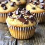 To make peanut butter chocolate chip muffins, gather these items: - 1 cup all-purpose flour - 1/2 cup whole wheat flour - 1/2 teaspoon baking soda - 1/2 teaspoon baking powder - 1/4 teaspoon salt - 1/2 cup creamy peanut butter - 1/2 cup brown sugar, packed - 1/4 cup granulated sugar - 2 large eggs - 1 teaspoon vanilla extract - 1/2 cup milk (dairy or non-dairy) - 1/2 cup chocolate chips - 1/4 cup chopped walnuts (optional) You can play with the recipe. Here are some ideas: - Use almond butter instead of peanut butter for a nutty twist. - Swap chocolate chips for dark chocolate or white chocolate chips. - Add dried fruits like raisins or cranberries for extra sweetness. - Replace walnuts with pecans or leave them out if you prefer. Quality ingredients make a big difference. Here are my tips: - Choose fresh flour and check the expiration date. - Use natural peanut butter with no added sugar or oils. - Select high-quality chocolate chips for rich flavor. - If using eggs, make sure they are at room temperature for better mixing. These choices can elevate your muffins and make them even more delightful. Enjoy creating your tasty treats! Start by preheating your oven to 350°F (175°C). This ensures even baking. Next, line a muffin tin with paper liners or lightly grease it. This helps the muffins come out easily. In a medium bowl, whisk together the all-purpose flour, whole wheat flour, baking soda, baking powder, and salt. Make sure they mix well. Set this bowl aside for later. In a large mixing bowl, combine the creamy peanut butter, brown sugar, and granulated sugar. Use an electric mixer on medium speed. Beat until the mixture is smooth and creamy. This should take about 1-2 minutes. Next, add the eggs one at a time. Mix well after each egg. Then, add the vanilla extract and mix until combined. Now, it’s time to combine the wet and dry mixtures. Gradually add the dry flour mix to the wet ingredients, alternating with the milk. Start and end with the flour. Mix until just combined. Don’t overmix, or the muffins will be tough. Now, gently fold in the chocolate chips. If you like, add in the chopped walnuts. Use a spatula to make sure everything is evenly mixed. Divide the muffin batter evenly among the cups. Fill each cup about 3/4 full. Place the muffin tin in the preheated oven. Bake for 18-20 minutes. To test doneness, insert a toothpick into the center of a muffin. If it comes out clean, the muffins are ready. Once baked, remove the muffins from the oven. Let them cool in the tin for 5 minutes. After that, transfer them to a wire rack to cool completely. Enjoy your tasty treats warm! When making peanut butter chocolate chip muffins, some common mistakes can ruin your bake. - Overmixing the batter: This makes muffins tough. Mix just until combined. - Not measuring ingredients: Use a scale or measuring cups for accuracy. - Skipping the rest time: Letting the batter rest helps the muffins rise better. The right texture is key for great muffins. Here are my tips to get it just right: - Use room temperature ingredients: Eggs and milk blend better at this temp. - Alternate wet and dry ingredients: This keeps the muffins fluffy and moist. - Fill muffin cups correctly: Fill each cup about 3/4 full to allow for rising. You can easily adapt this recipe to fit different dietary needs. Here are some ideas: - Gluten-free: Substitute with a gluten-free flour blend. - Dairy-free: Use almond milk or coconut milk instead of regular milk. - Nut-free: Replace peanut butter with sun butter or soy nut butter. Experimenting with these tips can help you make the perfect muffins for everyone! {{image_2}} You can add banana for a fun twist. Use one ripe banana, mashed. This adds sweetness and moisture. Simply mix the banana with the wet ingredients before adding flour. The banana flavor pairs great with chocolate and peanut butter. You will love the yummy results! If you want a nut-free option, swap out peanut butter for sun butter or soy nut butter. These choices work well and keep the texture smooth. Just remember to check for allergies. This way, everyone can enjoy these muffins without worry. Feel free to get creative with mix-ins! You can add dried fruits like cranberries or raisins. Seeds like chia or sunflower seeds also work well. Just fold them in with the chocolate chips before baking. These additions add flavor and nutrition. They make your muffins even more fun and tasty! To keep your muffins fresh, store them in an airtight container. This helps prevent drying out. You can place parchment paper between layers to avoid sticking. Keep them at room temperature for up to three days. For longer storage, consider the freezer. Freezing muffins is simple and effective. First, let the muffins cool completely. Wrap each muffin in plastic wrap. Place the wrapped muffins in a freezer bag. Label the bag with the date. You can freeze them for up to three months. This way, you always have a tasty treat on hand. When you're ready to enjoy your muffins, reheating brings back their warmth. You can use the microwave for a quick fix. Heat for about 15-20 seconds. For a crispier texture, use the oven. Preheat to 350°F (175°C) and heat for 5-10 minutes. This helps restore that fresh-baked goodness. Yes, you can easily make these muffins vegan. Substitute eggs with flax eggs. Mix one tablespoon of ground flaxseed with three tablespoons of water. Let it sit for five minutes to thicken. Use non-dairy milk instead of regular milk. Choose a plant-based yogurt to replace the creamy peanut butter. This keeps the flavor rich while being vegan. To make gluten-free muffins, swap the all-purpose flour and whole wheat flour with gluten-free flour. Look for a blend that works well for baking. Make sure it contains xanthan gum for better texture. You can also use almond flour or oat flour as alternatives. Just keep in mind that the texture may vary slightly. These muffins taste great warm and fresh. Serve them with a drizzle of melted chocolate for a treat. You can also add a sprinkle of sea salt on top to enhance the flavors. Pair them with a glass of milk or a hot cup of coffee. They are perfect for breakfast or as a snack. Enjoy them any time you crave something sweet! In this post, we explored how to make delicious Peanut Butter Chocolate Chip Muffins. We covered ingredients, preparation tips, and common mistakes to avoid. You learned about variations and storage tips to keep your muffins fresh. Remember, using quality ingredients makes a big difference. Try different mix-ins for new flavors. Baking is fun, so enjoy the process! With these guidelines, you can create tasty muffins that everyone will love. Happy baking!
