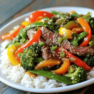 - 1 lb beef sirloin, thinly sliced - 2 cups mixed bell peppers (red, yellow, green), sliced - 1 cup broccoli florets - 1 cup snap peas For this dish, use beef sirloin. It is tender and cooks quickly. Slice it thinly for even cooking. Mixed bell peppers add great color and taste, while broccoli and snap peas give nice crunch. - 3 tablespoons soy sauce - 2 tablespoons oyster sauce - 1 tablespoon sesame oil - 1 tablespoon vegetable oil The sauces are key to flavor. Soy sauce brings saltiness, while oyster sauce adds depth. Sesame oil gives a nutty aroma. Use vegetable oil to cook the beef. - Sesame seeds - Green onions For a lovely finish, sprinkle sesame seeds on top. Chopped green onions add freshness and a pop of color. These simple touches make your dish look and taste great. Heating the vegetable oil Start by heating 1 tablespoon of vegetable oil in a large skillet or wok. Set the heat to medium-high. This step is key for a nice sear. Searing and sautéing the beef Next, add 1 pound of thinly sliced beef sirloin to the pan. Spread it out in a single layer. Let it sear for 1-2 minutes without stirring. This helps it brown nicely. After that, sauté it for about 4-5 minutes until it is fully cooked and browned. Once done, remove the beef from the pan and set it aside. Adding garlic and ginger In the same skillet, add 3 cloves of minced garlic and 1 tablespoon of minced fresh ginger. Stir quickly for about 30 seconds. This step adds great flavor but be careful not to burn them. Stir-frying bell peppers, broccoli, and snap peas Now, toss in 2 cups of mixed sliced bell peppers, 1 cup of broccoli florets, and 1 cup of snap peas. Stir-fry these colorful veggies for 4-5 minutes. You want them to be tender, but still crisp and vibrant. Returning beef to the skillet Once the veggies are ready, return the cooked beef to the skillet. This makes sure all the flavors mix well. Adding sauces and final cooking Pour in 3 tablespoons of soy sauce, 2 tablespoons of oyster sauce, and 1 tablespoon of sesame oil. Toss everything together to coat the beef and veggies in the sauce. Cook for an additional 2-3 minutes to heat through. Now, your Beef Veggie Stir Fry is ready to serve over jasmine rice! Enjoy the blend of flavors and colors on your plate. - Cut beef thinly for tender results: Thin slices cook quickly. This keeps the beef juicy and tender. Aim for slices about 1/4 inch thick. A sharp knife helps with this task. - Don’t overcrowd the pan: If you add too much beef at once, it will steam instead of sear. Cook in batches if needed. This way, you will get a nice brown color. - Use fresh ingredients: Fresh veggies bring bright colors and tastes. Choose firm, crisp bell peppers and vibrant snap peas. Fresh garlic and ginger add a punch. - Adjusting sauce to taste: Start with the sauce amounts in the recipe. After mixing, taste the dish. If it needs more flavor, add more soy sauce or oyster sauce. You can also try adding a pinch of sugar for balance. - Best rice options to pair: Jasmine rice is the go-to choice. Its soft texture complements the stir fry well. You can also use brown rice for a healthier option. Quinoa works too if you want a grain swap. - Additional garnishing ideas: Top your dish with sesame seeds and green onions for crunch. You can also add chopped cilantro or a squeeze of lime for a fresh twist. {{image_2}} You can easily switch the beef for chicken. Chicken breast works well here. Just slice it thin and follow the same steps. Cook the chicken until it is no longer pink. This change keeps the dish tasty and healthy. If you want a vegetarian option, use tofu. Firm tofu is best. Cut it into cubes and press it to remove water. Then, sauté it until golden brown. This adds a nice texture to the stir fry. For gluten-free needs, use gluten-free soy sauce. This sauce gives the same salty flavor without gluten. Brands like Tamari or coconut aminos work well. You can also try other sauces. Hoisin sauce or teriyaki sauce can add a nice twist. Just check the labels to ensure they are gluten-free. Feel free to add seasonal veggies. Zucchini, carrots, or snap peas add color and crunch. You can mix and match based on what you have at home. For a creative twist, try adding fruits like pineapple or mango. These add sweetness and a fun flavor. Experiment with different veggies to find your favorite combo! To keep your beef veggie stir fry fresh, store leftovers in an airtight container. Place it in the fridge right after it cools down. This helps keep the flavors and textures intact. Your stir fry will last up to three days in the fridge. Make sure to reheat only the amount you need to avoid sogginess. If you want to store your stir fry for longer, freezing is a great option. First, let the dish cool completely. Then, place it in a freezer-safe bag or container. Remove as much air as possible before sealing. This prevents freezer burn. Your stir fry can last in the freezer for about three months. When you’re ready to eat, thaw it in the fridge overnight. Reheat it in a skillet over medium heat for the best results. Preparing meals in advance can save you a lot of time. Cook a larger batch of the stir fry and divide it into portions. Use separate containers for each meal. This way, you have quick and easy meals ready for busy days. You can also pair it with rice or other grains when you’re ready to eat. Enjoying homemade meals was never this easy! For stir fry, I recommend using beef sirloin. This cut is tender and cooks quickly. It has good flavor and stays juicy. To prepare, slice the beef thinly against the grain. This helps keep it tender. You can also try flank steak or ribeye for added richness. Each option will give you a delicious meal. Yes, you can use frozen vegetables. They are handy and save time. However, fresh veggies often taste better. Frozen veggies can lose some crunch. If you use frozen, cook them for a shorter time. This keeps them vibrant and colorful. Fresh vegetables offer more flavor and texture. So, choose based on what you prefer. To add some heat, try these tips: - Add crushed red pepper flakes to the oil. - Mix in sliced jalapeños or Thai chilies. - Use a spicy sauce, like Sriracha, for a kick. - Top with fresh chili slices before serving. Adjust the spice level to your taste. Enjoy experimenting with flavors! This blog post detailed how to create a tasty stir fry. You learned about key ingredients like beef, fresh vegetables, and flavorful sauces. I shared important cooking steps, tips for great taste, and fun variations. As you explore this dish, remember to cut beef thinly and use fresh veggies. Enjoy experimenting with different proteins and seasonal vegetables. Each stir fry can be unique. With practice, you’ll master this quick and delicious meal for any night.