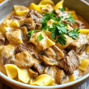 - 2 pounds beef chuck, cut into 1-inch pieces - 1 medium onion, diced - 3 cloves garlic, minced - 8 ounces mushrooms, sliced For this dish, beef chuck is your best choice. It becomes tender and juicy when cooked low and slow. The onion and garlic add a rich base flavor. Sliced mushrooms bring in an earthy taste that pairs well with beef. - 1 tablespoon Worcestershire sauce - 2 teaspoons dried thyme - 1 teaspoon paprika - Salt and pepper to taste Worcestershire sauce adds a deep, savory flavor to the mix. Dried thyme and paprika give warmth and depth. Don’t forget to season with salt and pepper. These simple seasonings are key to a great beef stroganoff. - 2 tablespoons cornstarch mixed with 2 tablespoons water (for thickening) - 1 cup sour cream or Greek yogurt - Fresh parsley, chopped (for garnish) If you want a thicker sauce, use cornstarch and water. Adding sour cream or Greek yogurt makes the dish creamy. Finally, fresh parsley adds a nice touch of color and flavor when you serve it. - First, cut the beef chuck into 1-inch pieces. - In a large bowl, season the beef with salt, pepper, paprika, and thyme. Make sure to coat it well. - Now, take your slow cooker. Add the seasoned beef, diced onion, sliced mushrooms, and minced garlic together. - Pour in the beef broth and Worcestershire sauce. Stir everything until it's all mixed well. - Place the lid on the slow cooker and set it up. - Choose the low setting and cook for 7-8 hours. If you’re short on time, you can set it to high for 3-4 hours. - Check the beef for tenderness. It should be very soft when done. - About 30 minutes before serving, cook the egg noodles. Follow the package instructions for best results. - If you want a thicker sauce, mix the cornstarch with water. Stir this into the slow cooker. Let it cook for 10-15 minutes to thicken. - Finally, stir in the sour cream or Greek yogurt. Mix until everything is creamy. Adjust the seasoning with salt and pepper as needed. - Serve the beef stroganoff over the cooked egg noodles. Don’t forget to garnish with chopped fresh parsley. To get the right sauce consistency, start with enough liquid. The beef broth should cover the meat and veggies. If you want a thicker sauce, add the cornstarch mix toward the end. This helps it thicken nicely. Stir it well and let it cook for 10-15 minutes. For seasoning, always taste as you go. Adding salt and pepper in steps helps build flavor. The dried thyme and paprika give a warm taste. Don’t be shy to add more if you like! Use a slow cooker that holds at least 6 quarts. This size fits 2 pounds of beef and all the extras well. It lets the meat cook evenly and stay tender. For prep, have a sharp knife and a cutting board ready. A sturdy spoon helps in mixing your ingredients. You might also need measuring cups for accuracy. Serve your beef stroganoff over egg noodles. They soak up the sauce and add a nice texture. You can also try rice or mashed potatoes as a base. For garnish, sprinkle chopped parsley on top. It adds color and freshness. You can also serve with a side of steamed veggies for a complete meal. {{image_2}} You can switch up the meat in this recipe. Try chicken or pork instead of beef. For a vegetarian option, use mushrooms or lentils. This keeps the dish tasty and fun. If you need a dairy-free option, swap sour cream for coconut yogurt or cashew cream. These work well and still add creaminess to your stroganoff. Want to add more flavor? Toss in some vegetables like carrots or peas. They not only boost nutrition but also add color. You can also try herbs like rosemary or spices like cumin. Each change makes the dish unique. You can serve beef stroganoff over rice instead of noodles. This gives a different texture and flavor. Another fun idea is to serve it in a bread bowl. The bread soaks up the sauce and adds a delicious crunch. To keep your beef stroganoff fresh, use airtight containers. Glass or plastic containers work well. Make sure they seal tightly to avoid air. Store leftovers in the fridge within two hours of cooking. This helps prevent bacteria growth. You can freeze beef stroganoff for later use. First, let it cool completely. Then, place it in a freezer-safe container. Leave some space at the top for expansion. It will stay fresh for up to three months. To reheat, thaw it in the fridge overnight. Heat on low in a pot, stirring gently. You can also use a microwave. Add a splash of beef broth if it seems dry. Beef stroganoff lasts about three to four days in the fridge. If you freeze it, it can last three months. Always check for any off smells or changes in texture before eating. Safe storage is key to enjoying your meal later! You can use Greek yogurt or cream cheese as a sour cream substitute. Both options add creaminess and flavor. For a lighter choice, try plain yogurt. If you want a dairy-free option, use cashew cream or coconut cream. Each option gives a different taste, so choose what you like best. Yes, you can use frozen beef. Just remember to add extra cooking time. If you use frozen beef, place it directly in the slow cooker. Avoid thawing it first. It may take about 30 minutes longer to cook. Always check that the beef reaches a safe temperature. Slow cooker beef stroganoff pairs well with many sides. Here are some great options: - Egg noodles: Classic and comforting. - Rice: White or brown rice works well. - Mashed potatoes: A creamy, hearty choice. - Steamed vegetables: Broccoli or green beans add freshness. - Salad: A simple green salad for crunch. These sides will balance the rich flavors of the beef stroganoff. Enjoy your meal! This blog covered how to make slow cooker beef stroganoff. We explored key ingredients like beef chuck, mushrooms, and spices. I showed you how to prepare, cook, and add finishing touches for the dish. You learned helpful tips and best equipment for cooking. I also shared fun variations and storage tips. Slow cooker beef stroganoff is a tasty, easy meal. Enjoy trying different ingredients and serving ideas. Your cooking will shine!