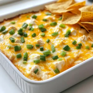 For the best buffalo chicken dip, you need key ingredients. Here’s what you will need: - 2 cups cooked shredded chicken - 1 cup cream cheese, softened - 1 cup shredded cheddar cheese - 1/2 cup ranch dressing - 1/2 cup buffalo sauce These ingredients create a creamy and spicy dip that everyone loves. The cream cheese adds richness. The shredded chicken gives it body. The ranch dressing cools the heat from the buffalo sauce. You can make the dip even better with a few optional items. Consider adding: - 1/4 cup blue cheese crumbles - 2 green onions, chopped (for garnish) Blue cheese adds a sharp flavor that pairs well with the buffalo sauce. Chopped green onions give a fresh taste and color to the dip. To serve the dip, I suggest using: - Tortilla chips - Celery sticks Tortilla chips add crunch and salt. Celery sticks bring a fresh crunch and help balance the dip's richness. You can also use carrots or crackers if you prefer. Enjoy your dip warm for the best flavor! {{ingredient_image_1}} Start by preheating your oven to 350°F (175°C). In a large mixing bowl, add the softened cream cheese, ranch dressing, and buffalo sauce. Use a fork or mixer to blend these until smooth. This base is key to a creamy dip. Next, fold in the cooked shredded chicken, shredded cheddar cheese, and blue cheese crumbles if you like that extra zing. Make sure everything mixes well. You want every bite to be full of flavor. Once your mixture is ready, transfer it to a baking dish. Spread the dip evenly to ensure it heats through. Place it in the preheated oven and bake for about 20 to 25 minutes. You’ll know it’s done when it bubbles and smells amazing. Remove the dip from the oven and let it cool for a few moments. This will help avoid burns when serving. Garnish your dip with chopped green onions for a fresh crunch. Serve it warm with tortilla chips or celery sticks. The crunch of the chips pairs perfectly with the creamy dip. This dish is a crowd-pleaser and makes any party fun. Enjoy sharing this tasty treat at your next gathering! When making buffalo chicken dip, some errors can ruin the dish. Here are key tips to avoid those mistakes: - Do not skip softening the cream cheese. If it’s cold, the dip won't mix well. - Mix all ingredients evenly. This helps each bite taste great. - Watch the baking time. Overbaking can dry out the dip. Check often. You can adjust the spice level to fit your taste. To make it spicier: - Add more buffalo sauce. Start with a tablespoon and taste. - Mix in diced jalapeños or hot sauce. This will give it a nice kick. For a milder dip: - Use less buffalo sauce. You can also add more cream cheese. - Try a mild ranch dressing. It balances the flavor without adding heat. Finding the right snacks to serve with your dip makes it even better. Here are my top picks: - Tortilla chips: These are classic. They add crunch and pair well with the dip. - Celery sticks: They provide a fresh and crunchy contrast. - Veggie sticks: Carrots and bell peppers add color and taste. - Crackers: They offer a different texture and flavor. Experiment with these options to find your favorite! Pro Tips Choose the Right Chicken: For the best flavor and texture, use rotisserie chicken. It's already seasoned and saves you time on cooking. Adjust the Heat: If you prefer a milder dip, reduce the amount of buffalo sauce or opt for a milder variety. You can also add more ranch dressing to balance the heat. Make it Ahead: Prepare the dip a day in advance and store it in the refrigerator. Just bake it when you're ready to serve for a stress-free appetizer. Experiment with Cheese: Feel free to mix in different cheeses like pepper jack for a spicy kick or mozzarella for a creamier texture. {{image_2}} If you want to change the cream cheese, consider Greek yogurt. It adds a tangy taste and keeps it creamy. You can also use sour cream. This option gives a rich flavor. Silken tofu is a great dairy-free choice. It blends well and keeps the dip smooth. Cheddar cheese is a classic choice, but you can mix it up! Try pepper jack for a spicy kick. Monterey Jack adds a nice creaminess. You can even use a blend of cheeses for more depth. Mozzarella gives a stretchy texture, which is fun. Want to add more flavor? Try adding diced jalapeños for heat. You can include garlic powder or onion powder for extra taste. Hot sauce intensifies the buffalo flavor. A splash of lime juice brightens the dip. Fresh herbs like cilantro or parsley can add a fresh touch, too. After your party, you might have some dip left. First, let it cool to room temperature. Then, transfer the dip to an airtight container. This helps keep it fresh. Store it in the fridge for up to four days. Always make sure it is sealed well to avoid any strange smells. Freezing your dip is easy and smart. To freeze, place the cooled dip in a freezer-safe container. Leave some space at the top, as it may expand when frozen. You can freeze it for up to three months. Label the container with the date. This way, you can enjoy it later! To reheat, start by taking the dip out of the fridge or freezer. If frozen, let it thaw in the fridge overnight. For reheating, place it in an oven-safe dish. Heat it at 350°F (175°C) for about 20 minutes. Stir it halfway through to warm evenly. You can also use a microwave. Heat in short bursts, stirring in between, until hot. Enjoy it warm with your favorite chips or veggies! Yes, you can make Buffalo Chicken Dip ahead of time. Prepare the dip and store it in the fridge. Cover it well to keep it fresh. You can bake it later when you need it. Just remember to let it sit at room temp for a bit before baking. Buffalo Chicken Dip pairs well with many tasty options. Here are some ideas: - Tortilla chips - Celery sticks - Carrot sticks - Pita bread - Crackers These sides add crunch and freshness to each bite. You can mix and match to please your guests. Buffalo Chicken Dip lasts about 3 to 4 days in the fridge. Make sure to store it in an airtight container. If it smells off or looks strange, it's best to toss it. Enjoy it while it’s fresh for the best taste! Buffalo chicken dip is a tasty, fun dish that many love. We explored key ingredients, useful tips, and easy steps for making it. You learned about variations and storage options too. By following these insights, you can whip up a tasty dip every time. Experiment with flavors and enjoy this crowd-pleaser at your next gathering!