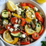To make a tasty Mediterranean ground beef stir fry, gather these ingredients: - 1 lb ground beef - 2 tablespoons olive oil - 1 medium onion, chopped - 3 cloves garlic, minced - 1 red bell pepper, sliced - 1 zucchini, sliced - 1 cup cherry tomatoes, halved - 1 teaspoon dried oregano - 1 teaspoon ground cumin - Salt and pepper to taste - ½ cup feta cheese, crumbled - Fresh parsley, chopped for garnish - Lemon wedges for serving You can swap ingredients for what you have. Use ground turkey or chicken instead of beef. If you don't have feta, try goat cheese or omit it. For the veggies, you can use bell peppers of any color. Spinach or kale can replace zucchini. Fresh herbs like basil or mint can add flavor too. When picking fresh produce, look for vibrant colors. The skin should be firm and smooth. For tomatoes, choose ones that feel heavy for their size. For bell peppers, look for shiny skin. Avoid any with soft spots or wrinkles. Always check the smell; it should be fresh and sweet. This simple care helps your dish taste great! {{ingredient_image_1}} Start by gathering your ingredients. You need ground beef, onion, garlic, bell pepper, zucchini, cherry tomatoes, and spices. Chop the onion and slice the red bell pepper and zucchini. Halve the cherry tomatoes. This makes cooking easy and fun. Next, measure out your spices: oregano, cumin, salt, and pepper. Heat two tablespoons of olive oil in a large skillet on medium heat. Add the chopped onion and sauté for 3-4 minutes. Wait until it turns translucent. Then, stir in the minced garlic. Cook for one more minute until the smell fills your kitchen. Increase the heat to medium-high and add the ground beef. Break it up with a spatula. Cook until it’s browned, which takes about 5-7 minutes. Next, season the beef with oregano, cumin, salt, and pepper. This gives it a rich flavor. Toss in the sliced bell pepper and zucchini. Stir-fry these vegetables for 4-5 minutes until they are tender. Lastly, gently fold in the halved cherry tomatoes. Cook for another 2-3 minutes until they are warm. Once your stir fry is done, take it off the heat. Sprinkle crumbled feta cheese over the top. The cheese will warm slightly from the heat. To finish, garnish with chopped fresh parsley. Serve with lemon wedges on the side for a zesty kick. You can put the stir fry in a big bowl or on a platter for a nice look. Enjoy! For a great stir fry, use a hot skillet. Start by heating olive oil over medium heat. Add the onion and cook until it is soft. This step builds flavor. Next, add the garlic for a minute. The garlic makes the dish fragrant. When you add the ground beef, break it apart with your spatula. Cook it until it turns brown and is no longer pink. This takes about 5 to 7 minutes. Be sure to keep stirring so nothing burns. To make your stir fry pop, add some fresh herbs. Fresh parsley works well as a garnish. You can also squeeze lemon juice on top before serving. This adds a bright, zesty taste. If you like heat, add red pepper flakes or a dash of hot sauce. For a touch of sweetness, try using a splash of balsamic vinegar. This will balance the savory notes from the beef and spices. One common mistake is overcrowding the skillet. If you add too many ingredients at once, the food will steam instead of fry. This can make your veggies mushy. Another mistake is not seasoning enough. Always taste as you cook and adjust the salt and pepper. Lastly, don’t forget the final touches. A sprinkle of feta adds creaminess, while fresh parsley gives color and flavor. Always serve with lemon wedges for that fresh kick! Pro Tips Quality of Beef: Use high-quality ground beef for better flavor and texture. Grass-fed or organic options are excellent choices. Vegetable Variations: Feel free to swap in your favorite vegetables such as spinach or eggplant to enhance the stir fry. Cheese Alternatives: If you prefer a different cheese, try using goat cheese or Parmesan for a unique twist. Serving Suggestions: This stir fry pairs beautifully with couscous or quinoa for a complete meal. Consider adding a side salad for extra freshness. {{image_2}} If you want a vegetarian dish, use lentils or chickpeas. They add protein and fiber. You can also try crumbled tofu for a vegan option. Tofu soaks up flavors well. Add some soy sauce for extra taste. Swap beef for these options in equal parts. You can use turkey or chicken instead of beef. Ground turkey is leaner, and it cooks fast. Chicken also works and stays juicy. For a seafood twist, try shrimp or scallops. Both add a nice flavor and cook quickly. Adjust cooking time based on the protein you choose. Use what you find fresh in the market. In spring, add asparagus or peas. Summer is great for eggplant or bell peppers. In fall, use squash or root veggies like carrots. Winter is perfect for hearty greens like kale. Mix these seasonal veggies into the stir fry for variety. To store your Mediterranean Ground Beef Stir Fry, let it cool first. Place it in an airtight container. This keeps the dish fresh and safe. Your leftovers should last about 3 to 4 days in the fridge. Always label the container with the date. This way, you know when to eat it by. When you are ready to eat your leftovers, reheat them on the stove. Use a medium heat and stir often. This helps the food warm evenly. You can also microwave it for about 2 to 3 minutes. Stir halfway through for best results. The goal is to reach a safe temperature of 165°F. If you want to freeze the stir fry, use a freezer-safe container. It’s best to freeze it within 2 days of cooking. This keeps the flavors fresh. The stir fry can last for about 2 to 3 months in the freezer. When you are ready to eat, thaw it in the fridge overnight. Reheat it on the stove or in the microwave. Enjoy a quick and tasty meal later! You can serve Mediterranean Ground Beef Stir Fry with several tasty sides. Here are a few ideas: - Rice: White or brown rice works well and soaks up the juices. - Pita Bread: Warm pita adds a nice crunch and is great for scooping. - Salad: A fresh Greek salad adds a crisp contrast to the dish. - Quinoa: This healthy grain pairs well with the beef and veggies. Each of these sides complements the flavors of the stir fry and makes your meal complete. Yes, you can make Mediterranean Ground Beef Stir Fry ahead of time. Here’s how: - Cook the Beef: Prepare the stir fry as per the recipe. - Cool Properly: Let it cool down before storing. - Store in Fridge: Keep it in an airtight container. This dish stays fresh in the fridge for up to three days. Just reheat before serving. Absolutely! You can easily adjust the spice level to suit your taste. Here are some options: - Add Chili Flakes: Sprinkle in some red chili flakes for heat. - Use Hot Sauce: A dash of your favorite hot sauce can spice things up. - Remove Spices: If you prefer milder flavors, skip the cumin or oregano. Feel free to experiment until you find the right balance for your palate! This post shared all you need for a great Mediterranean Ground Beef Stir Fry. We discussed essential ingredients, steps for cooking, and handy tips. You can adjust the flavors and try new proteins for variety. Remember to store leftovers right and use the reheating tips to keep them tasty. With this knowledge, you can create a fun and flavorful dish. Enjoy cooking and happy eating!