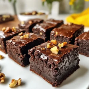 To make the best vegan fudgy brownies, gather these ingredients: - 1 cup almond butter (or your favorite nut butter) - 1 cup maple syrup - 1/2 cup unsweetened cocoa powder - 1 tsp vanilla extract - 1/2 cup oat flour (or whole wheat flour) - 1/4 tsp baking soda - 1/4 tsp salt - 1/2 cup dark chocolate chips (dairy-free) - 1/4 cup chopped walnuts or pecans (optional) These ingredients create a rich, fudgy texture that you will love. If you want to jazz up your brownies, consider these mix-ins: - Chopped nuts like walnuts or pecans add crunch. - Dried fruits, such as cranberries or cherries, bring sweetness. - Coconut flakes can offer a nice chewy texture. - A sprinkle of sea salt on top enhances the chocolate flavor. Feel free to experiment with your favorite add-ins. Each provides a unique twist. Sometimes, allergies or preferences guide our choices. Here are some great substitutes: - Nut butter: Use sunflower seed butter or pumpkin seed butter for nut-free options. - Maple syrup: Agave syrup or brown rice syrup works as a sweetener. - Oat flour: Almond flour or coconut flour can be used if you're gluten-free. - Dark chocolate chips: Try carob chips or chopped dark chocolate for dairy-free. These substitutes keep your brownies delicious while meeting dietary needs. Happy baking! {{ingredient_image_1}} 1. Preheat your oven to 350&deg;F (175&deg;C). Line an 8x8 inch baking pan with parchment paper. Leave a bit of paper over the edges to lift out the brownies later. 2. In a large bowl, mix 1 cup of almond butter and 1 cup of maple syrup. Stir until it is smooth and creamy. 3. Add 1/2 cup of unsweetened cocoa powder and 1 teaspoon of vanilla extract. Mix until everything blends well. 4. Sift in 1/2 cup of oat flour, 1/4 teaspoon of baking soda, and 1/4 teaspoon of salt. Stir gently until just combined. Avoid overmixing. 5. Fold in 1/2 cup of dark chocolate chips and optional 1/4 cup of chopped walnuts or pecans. 6. Pour the batter into your lined pan. Use a spatula to spread it evenly. Bake the brownies for 25 to 30 minutes. Check them by inserting a toothpick in the center. If it comes out mostly clean, they are done. A few moist crumbs are okay! To ensure your brownies are fudgy, look for a slight shine on the top. They should not feel too soft but should give a little when pressed. If you want them less gooey, bake a few extra minutes. Always let them cool in the pan for about 10 minutes before lifting them out. Then, let them cool completely on a wire rack for the best texture. To get that rich, fudgy texture, use almond butter. It adds creaminess and depth. Use maple syrup for sweetness and moisture. Select high-quality cocoa powder for a deep chocolate taste. Remember, do not overmix the batter. Stir just enough to combine the ingredients. Your brownies will turn out soft and gooey this way. One big mistake is overbaking. Bake for just 25 to 30 minutes. Check for doneness with a toothpick. It should come out with a few moist crumbs. Another mistake is not measuring ingredients correctly. Use measuring cups and spoons for accuracy. Lastly, don&rsquo;t skip the parchment paper. It helps with easy removal and clean-up. You need a few simple tools to make this recipe easier. Have a large mixing bowl for mixing the batter. A whisk is great for blending the wet ingredients. Use a spatula for spreading the batter evenly. Lastly, an 8x8 inch baking pan is perfect for this recipe. If you have a wire rack, it helps cool the brownies evenly. Pro Tips Use Fresh Ingredients: Ensure your nut butter and cocoa powder are fresh for the best flavor and texture in your brownies. Don&rsquo;t Overmix: Mixing the batter just until combined will help keep the brownies fudgy instead of cakey. Experiment with Mix-Ins: Feel free to add your favorite nuts, dried fruits, or even a swirl of peanut butter for added flavor and texture. Store Properly: Keep brownies in an airtight container at room temperature for up to a week, or refrigerate for longer-lasting freshness. {{image_2}} You can easily change the taste of your vegan fudgy brownies. For a mint flavor, add 1/2 teaspoon of peppermint extract. This gives your brownies a fresh twist. If you love peanut butter, swirl in 1/2 cup of creamy peanut butter. This adds richness and a nutty taste. You can also mix in spices like cinnamon or chili powder for a fun kick. If you need a gluten-free option, substitute oat flour with almond flour or coconut flour. Almond flour makes brownies moist and adds protein. Coconut flour absorbs more liquid, so use less. Start with 1/4 cup of coconut flour and add more if needed. Check your brownies while baking. They may need extra time to cook through. To make your brownies healthier, you can reduce the sugar by using ripe bananas or applesauce. These fruits add natural sweetness and moisture. You can also swap half of the almond butter for unsweetened applesauce. This lowers the fat content while keeping the brownies delicious. Try using dark chocolate chips with a higher cocoa content for added health benefits. To keep your vegan fudgy brownies fresh, store them in an airtight container. I recommend placing parchment paper between layers. This way, they won&rsquo;t stick together. You can keep them at room temperature for up to three days. If you want to store them longer, move them to the fridge. They will stay good for about a week in the fridge. Freezing brownies is simple and effective. First, let the brownies cool completely. Then, cut them into squares. Wrap each square tightly in plastic wrap. Place the wrapped squares in a freezer-safe container or bag. They can last up to three months in the freezer. When you want to eat them, just thaw in the fridge or at room temperature. You can also warm them in the microwave for a few seconds for a fresh-baked taste. These brownies have a good shelf life. At room temperature, they last about three days. In the fridge, they can stay fresh for a week. If you see any mold or an off smell, it&rsquo;s time to toss them. Brownies that feel dry or hard may not taste as good. Always check for freshness before enjoying your delicious treat! Yes, you can use any nut butter you like. Peanut butter works well too. Sunflower seed butter is a great nut-free option. Just remember, the flavor might change a bit with each butter. You can replace maple syrup with mashed bananas or unsweetened applesauce. These will add sweetness and moisture. You might need to adjust the other ingredients a bit for the right texture. To cut even squares, use a sharp knife. First, let the brownies cool completely. Then, wipe the knife with a damp cloth between cuts. This helps keep the edges clean and neat. Making vegan fudgy brownies is simple and fun. We covered essential ingredients, step-by-step instructions, and tips for a perfect bake. Exploring flavor variations and storage methods enhances your brownie game. Avoid common mistakes, and you'll impress everyone with your treats. Now, you have the tools to create tasty, fudgy brownies and enjoy them at their best. Happy baking!