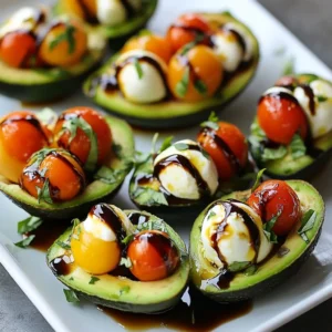 - 2 ripe avocados - 1 cup cherry tomatoes, halved - 1 cup fresh mozzarella balls (bocconcini), halved - 1/4 cup fresh basil leaves, chopped - 2 tablespoons balsamic glaze - 1 tablespoon extra virgin olive oil - Salt and pepper to taste You can add some extras to make this dish even better. Try these: - Sliced red onion for crunch - Pine nuts for a nutty flavor - Grilled chicken for protein - A dash of crushed red pepper for heat You will need a few simple tools to make this dish: - A sharp knife for slicing - A mixing bowl for the filling - A spoon for scooping out the avocado - A small bowl for mixing the glaze - A serving plate for a beautiful presentation {{ingredient_image_1}} Start by slicing the avocados in half lengthwise. Then, remove the pits carefully. Use a spoon to scoop out a small amount of the avocado flesh. This creates extra space for your filling. You want to keep the skin intact, so scoop gently. Set your avocado halves aside on a plate. In a medium bowl, combine the halved cherry tomatoes and mozzarella balls. Add the chopped basil to the bowl. Next, drizzle in the extra virgin olive oil and balsamic glaze. Season with salt and pepper to your taste. Mix everything gently until well combined. This bright mixture is key to a fresh taste. Take the Caprese filling and carefully spoon it into the avocado halves. Fill each half generously. If you want an extra touch, drizzle more balsamic glaze on top. This adds a beautiful shine and flavor. Serve your stuffed avocados on a colorful plate or a wooden board. A few extra basil leaves make a lovely garnish. Enjoy your fresh and tasty dish! Choose ripe avocados for the best flavor. Look for avocados that yield slightly to gentle pressure. If they feel hard, they need more time to ripen. If they feel too soft, they may be overripe. The skin should be dark green or almost black. Avoid any with large dark spots or blemishes. A little seasoning goes a long way. Use salt and pepper to bring out the natural flavors. You can add garlic powder or crushed red pepper for a kick. Fresh lemon juice brightens the flavors as well. Always taste your Caprese filling before stuffing the avocados. Adjust seasonings based on your preference. Presentation matters. Serve the stuffed avocados on a wooden board or a colorful plate. Garnish with extra basil leaves for a fresh touch. Drizzle additional balsamic glaze over the top for an eye-catching finish. This simple step makes your dish look gourmet. Your guests will be impressed! Pro Tips Choose Ripe Avocados: Make sure to select avocados that are slightly soft to the touch, indicating they are ripe and ready to be enjoyed. Fresh Ingredients Matter: Using fresh mozzarella and basil will enhance the flavors, making your stuffed avocados even more delicious. Customize Your Fillings: Feel free to add other ingredients like diced red onion or olives to the Caprese mixture for a unique twist. Serve Immediately: For the best taste and presentation, serve the stuffed avocados right after preparing them to prevent browning. {{image_2}} You can change the cheese to fit your taste. Try feta cheese for a salty kick. Goat cheese adds a tangy flavor. A sharp cheddar gives a nice twist. Just remember to keep the cheese in small pieces. It should blend well with the other ingredients. Adding protein makes this dish heartier. Grilled chicken works great for a filling option. Just chop it into small pieces and mix it in. Shrimp is another tasty choice. Cook the shrimp until pink and tender, then dice it. Both options pair well with the fresh flavors of tomatoes and basil. You can make this dish vegan easily. Replace mozzarella with vegan cheese. Many brands offer great dairy-free options. You can also skip the cheese and add more tomatoes or veggies. Try adding chickpeas for protein. This keeps the dish rich and satisfying while staying plant-based. To store leftover Caprese stuffed avocados, place them in an airtight container. This helps keep them fresh. If you can, cover the avocados with plastic wrap. This adds another layer of protection. Make sure to keep them in the fridge. Reheating stuffed avocados is tricky. I recommend eating them cold. The flavors blend well when they chill. If you must reheat, try a low setting in the oven. Heat just until warm, but avoid cooking them too long. You want to keep the avocado creamy. For best taste, eat the stuffed avocados within two days. After this, the avocado may brown and lose flavor. Always check for freshness before eating. If they look or smell off, it's best to discard them. Enjoy your tasty dish while it's at its best! Yes, you can prep some parts ahead. You can chop the tomatoes and basil. Mix them with olive oil and balsamic glaze. Store this mixture in the fridge for up to two hours. However, wait to stuff the avocados until just before serving. This keeps the avocados fresh and green. If you don't have mozzarella, try feta or goat cheese. These cheeses add a tangy flavor. You can also use vegan cheese for a dairy-free option. Just make sure it melts well if you want a creamy texture. Yes, Caprese Stuffed Avocados are very healthy! Avocados are full of good fats. They help your heart and keep you full. Tomatoes add vitamins, and basil gives you antioxidants. This dish is a great mix of nutrients. Plus, it is low in carbs and high in healthy ingredients. In this blog post, we explored how to make Caprese Stuffed Avocados. We listed ingredients and useful optional add-ins. I explained the steps for preparing the avocados, making the filling, and assembling the dish. We discussed tips for selecting great avocados and enhancing taste. You learned about variations with cheese and protein options. Finally, I provided storage tips to keep your dish fresh. Enjoy making and sharing this healthy, tasty treat!