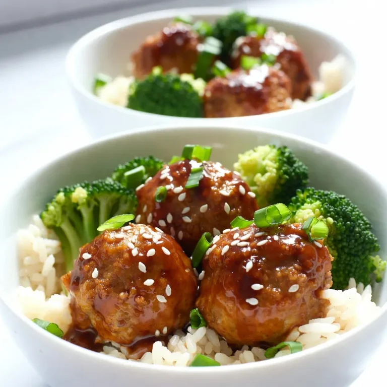- 1 lb ground chicken or turkey - 1/2 cup breadcrumbs - 1/4 cup grated Parmesan cheese - 1 egg - 2 green onions, finely chopped - 2 cloves garlic, minced - 1 tsp ginger, minced - Salt and pepper to taste - 1/4 cup soy sauce - 1/4 cup honey - 2 tbsp rice vinegar - 1 tbsp sesame oil - 1 cup cooked jasmine rice - 1 cup steamed broccoli florets - Sesame seeds for garnish You can switch ground chicken for ground beef or pork. This change gives a different taste. For a vegan option, use plant-based meat. Replace the egg with flaxseed meal mixed with water. Instead of jasmine rice, try brown rice or quinoa for more fiber. You can also change broccoli for any green veggie, like snap peas or bok choy. One serving of Teriyaki Meatball Bowls has about 400 calories. It includes 20 grams of protein, 30 grams of carbs, and 18 grams of fat. This dish offers a good balance of nutrients. You get protein from the meat and healthy carbs from the rice and veggies. Plus, it contains vitamins and minerals from the broccoli and green onions. {{ingredient_image_1}} Start by preheating your oven to 400°F (200°C). This step is key for cooking the meatballs evenly. A hot oven helps them turn golden brown and keeps them juicy. In a large bowl, add the ground chicken or turkey. Then, mix in the breadcrumbs, grated Parmesan cheese, and the egg. Next, chop the green onions and add them to the bowl along with the minced garlic and ginger. Sprinkle in some salt and pepper. Use your hands to mix gently until everything is just combined. Don’t overmix; this keeps the meatballs tender. Take the meatball mixture and roll it into about 1-inch balls. Place them on a baking sheet lined with parchment paper. Bake in the preheated oven for 15-20 minutes. They should be cooked through and golden on the outside. You can check by cutting one open; it should be no longer pink inside. While the meatballs bake, it’s time to make the teriyaki sauce. In a small saucepan, combine the soy sauce, honey, rice vinegar, and sesame oil. Heat this mixture over medium heat. Stir until the honey dissolves, then let it simmer for about 2-3 minutes. Remove it from the heat once it thickens a bit. When the meatballs are done baking, take them out of the oven. Drizzle the teriyaki sauce over the meatballs. Gently toss them to coat each one evenly in the sauce. This adds flavor and a nice shine. Now, it's time to put everything together. In a serving bowl, start with a layer of cooked jasmine rice. Add a handful of steamed broccoli florets on top. Finally, place the teriyaki meatballs on the broccoli. For a finishing touch, sprinkle sesame seeds over everything. You can also add more chopped green onions if you like. Enjoy your meal! To make great meatballs, keep these tips in mind: - Use fresh ingredients. Fresh garlic and ginger add more flavor. - Don’t overmix. Mix just enough to combine. Overmixing makes them tough. - Keep them uniform. Roll meatballs about 1-inch wide for even cooking. - Chill before baking. Chill them for 15 minutes to help them hold shape. To boost the teriyaki flavor, try these methods: - Marinate the meatballs. Let them soak in teriyaki sauce for 30 minutes before cooking. - Add sesame seeds. Mix in sesame seeds for a nutty taste. - Use fresh herbs. Add cilantro or basil for a fresh twist. - Adjust sweetness. If you like it sweeter, add more honey or brown sugar. A beautiful presentation makes the meal more special. Here are some ideas: - Use deep bowls. Layer rice, broccoli, and meatballs for a colorful display. - Drizzle extra sauce. Add teriyaki sauce around the edges for flair. - Garnish well. Top with sesame seeds and chopped green onions for a pop of color. - Serve with chopsticks. It adds fun and makes it interactive. Pro Tips Use Fresh Ingredients: The flavor of your meatballs will significantly improve by using fresh garlic and ginger instead of powdered forms. Don’t Overmix: When combining the meatball ingredients, mix until just combined for a tender meatball texture. Customize Your Sauce: Feel free to adjust the sweetness or saltiness of the teriyaki sauce by adding more honey or soy sauce to suit your taste. Meal Prep Friendly: These meatballs can be made ahead of time and stored in the fridge or freezer for quick meals throughout the week. {{image_2}} You can use many meats for these meatballs. Ground chicken or turkey works well. They keep the dish light and tasty. You can also try ground beef or pork for a richer flavor. Each meat adds its own twist. Experimenting with different meats can change the whole bowl. If you want a vegetarian or vegan dish, I have great options. Use plant-based ground meat as a substitute. You can also make meatballs with lentils or chickpeas. They will give you a hearty texture. Mix in breadcrumbs, spices, and some veggies for flavor. These options are just as satisfying and tasty. Want to boost the flavor and nutrition? You can add some extras to the meatball mix. Try minced bell peppers or grated carrots. These add color and crunch. Adding fresh herbs like cilantro or basil can enhance the taste. For more nutrition, consider mixing in some spinach or kale. These simple add-ins make your meal even better. To keep your leftover meatball bowls fresh, let them cool first. Place the meatballs, rice, and broccoli in an airtight container. Store them in the fridge for up to three days. This way, you can enjoy them later without losing flavor. When reheating, I suggest using a microwave or oven. If using a microwave, put the meatball bowl on a safe plate. Heat for about 1-2 minutes. Make sure to cover it to keep moisture. If using the oven, set it to 350°F (175°C) and heat for about 10-15 minutes. This keeps the meatballs juicy. If you want to save the meatball bowls for later, freezing is a great option. Place the meatballs and rice in separate freezer-safe bags. They can last up to three months in the freezer. When you're ready to eat, thaw them in the fridge overnight before reheating. This keeps the flavors fresh and tasty. You can check if the meatballs are done by using a meat thermometer. They should reach an internal temperature of 165°F (74°C). If you don’t have a thermometer, look for a nice golden brown color on the outside. You can also cut one in half; the center should no longer be pink. Yes, you can use store-bought teriyaki sauce for convenience. Just pour it over the meatballs after baking. This saves time but may have different flavors than homemade sauce. Always check the label for gluten or sugar content if you have dietary restrictions. Teriyaki Meatball Bowls taste great with various sides. Here are some ideas: - Steamed broccoli - Sautéed bok choy - Cucumber salad - Edamame - Fried rice These sides add color and balance to the dish. The Teriyaki Meatball Bowls last about 3 to 4 days in the fridge. Store them in an airtight container. Make sure the meatballs cool down before sealing. This keeps them fresh and tasty for your next meal. Yes, you can make this recipe gluten-free. Use gluten-free breadcrumbs and tamari instead of soy sauce. These swaps keep the dish flavorful without gluten. Always check labels to ensure the products are gluten-free. In this blog post, we covered how to make teriyaki meatball bowls. You learned about key ingredients and options for customization. I shared step-by-step instructions to ensure your success. Tips for perfect meatballs and options for variations helped enhance your dish. Finally, I provided storage tips to keep your leftovers fresh. These meatball bowls are simple and fun to make. I hope you enjoy creating your own delicious versions! Start cooking and impress your friends and family.