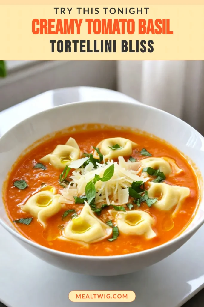 Warm up with this creamy tomato basil soup that features delightful tortellini! This easy tomato soup recipe is a perfect comfort food soup for busy weeknights. Packed with flavor, fresh basil, and cheesy tortellini, it's a vegetarian tortellini soup everyone will love. Discover how to make this delicious creamy tomato basil tortellini soup today! Save this recipe for your next meal! #CreamyTomatoBasilSoup #TortelliniSoupRecipe #VegetarianSoup #EasyTomatoSoup